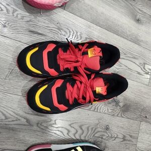 Puma Black and Red Athletic Shoes with Yellow Highlights